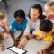 Teacher-using-app-on-a-tablet-wi